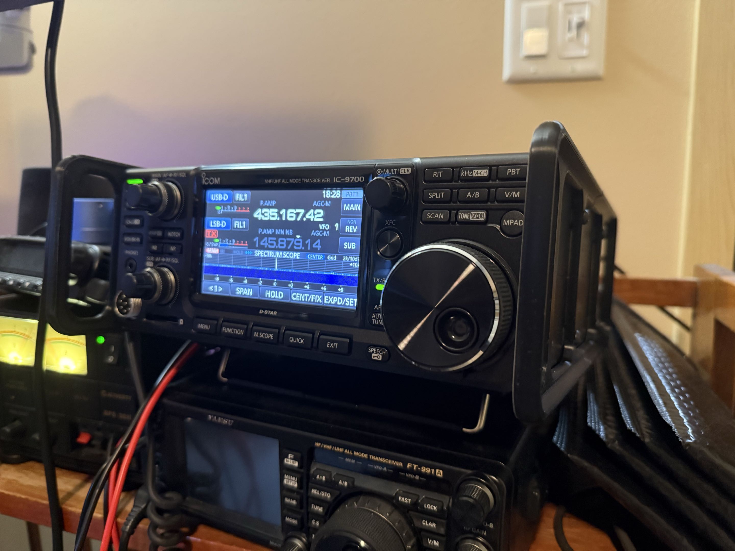 Satellite gear — an Icom IC-9700, a handheld with an Arrow Yagi, or an SDR